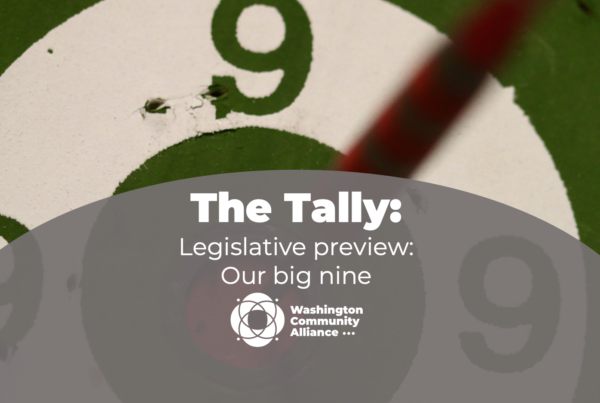 A photo of a dart board showing a number 9. On the bottom, there's a grey field with The Washington Community Alliance logo and white text that says "The Tally: Legislative preview: Our big nine"